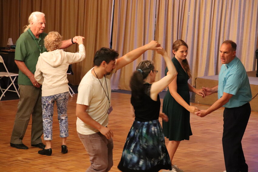 Festival volunteers host an East Coast swing dance lesson on the Evergreen Elks Lodge's dance floor.